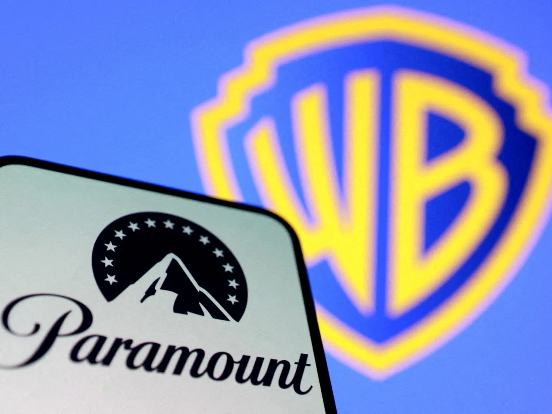The Paramount Pictures logo beside the Warner Bros. shield logo against a blue background.
